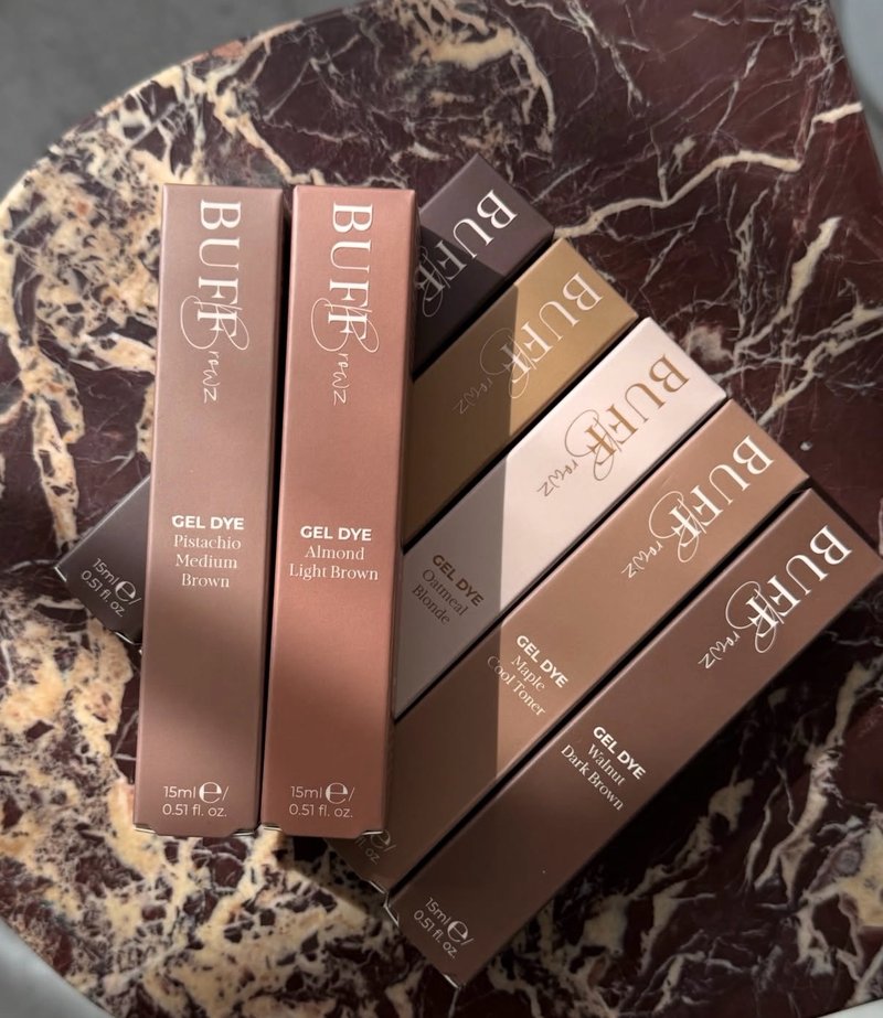 Buff Browz gel dye boxes on a marble tray