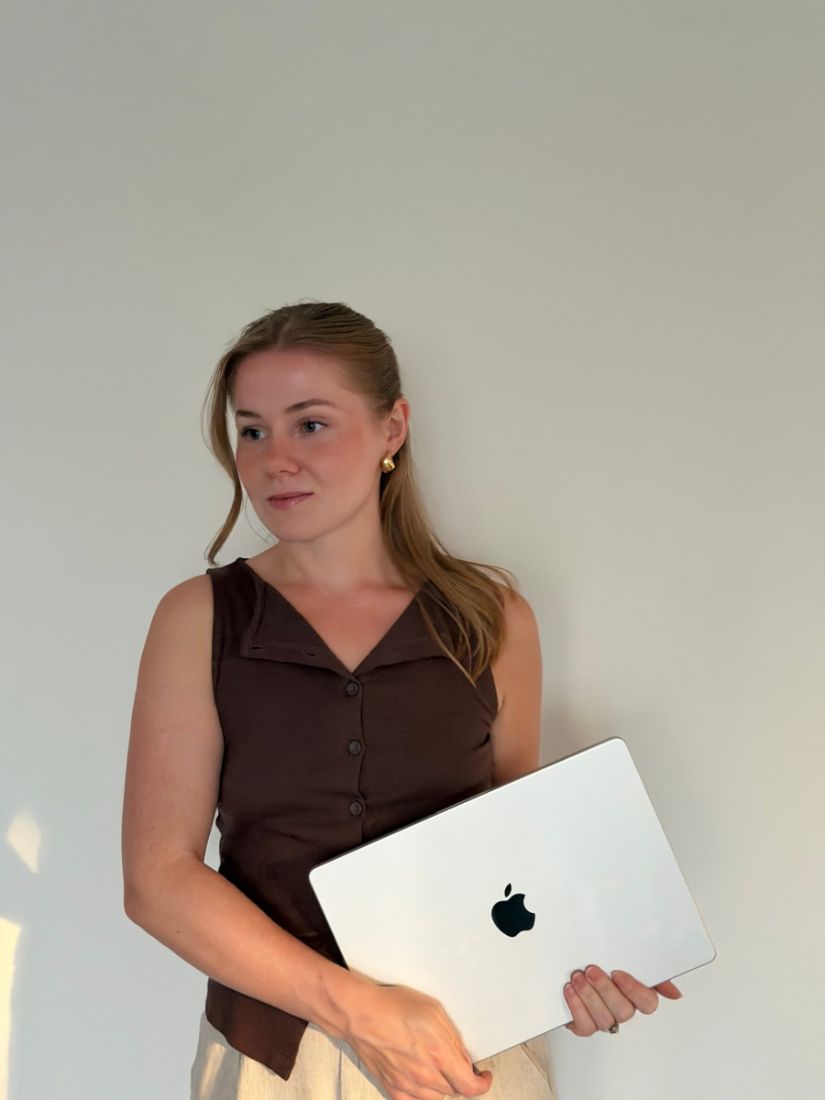 Molly holding a laptop